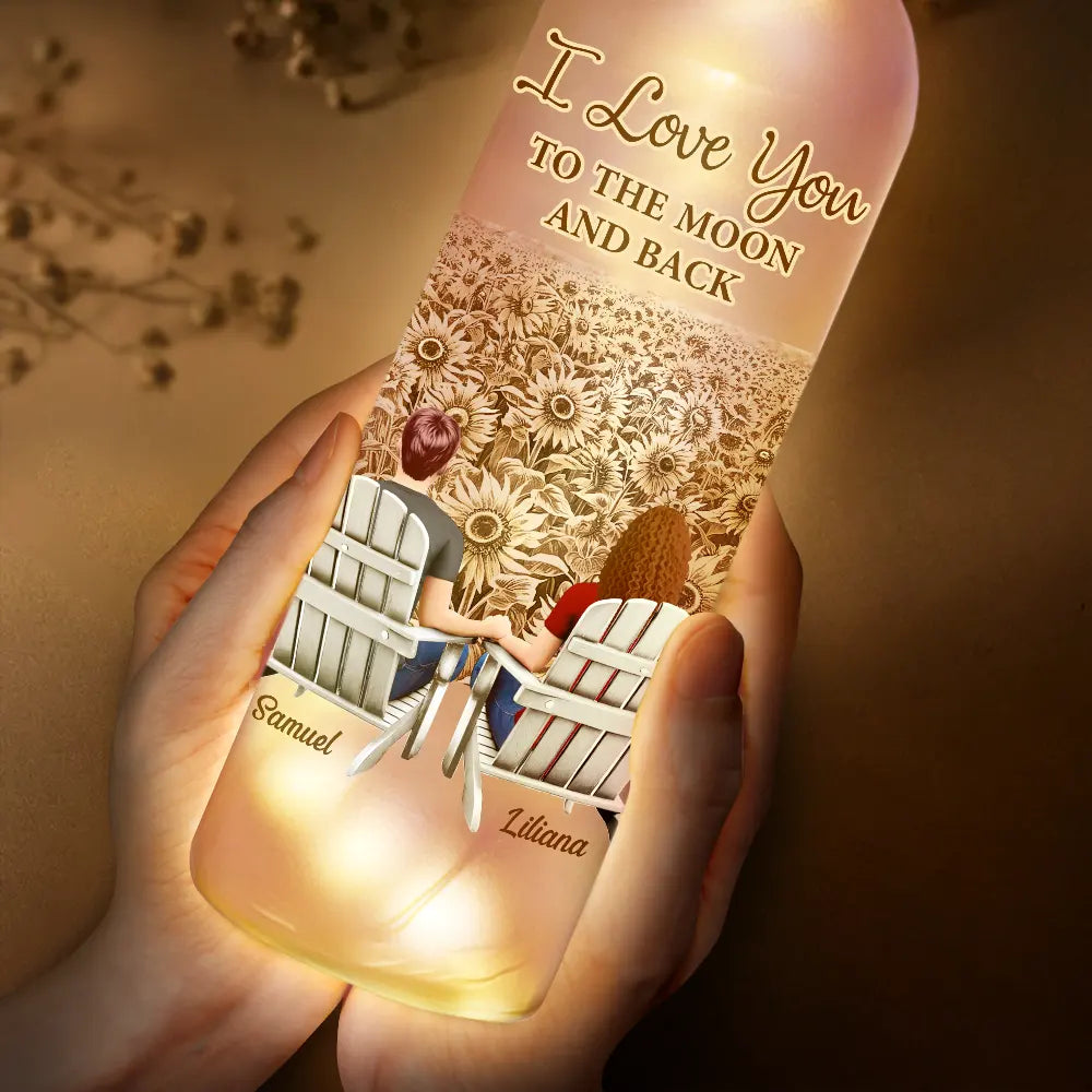 Personalized bottle light held in hands, warm LED glow. "You & Me We Got This" romantic decor gift.