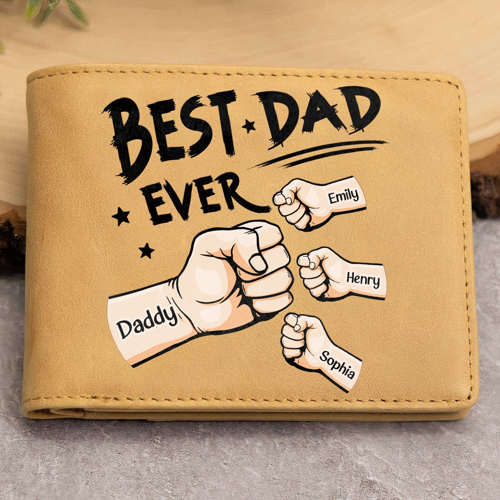 Personalized Best Dad Ever leather wallet with fist bump design for Emily, Henry, and Sophia.