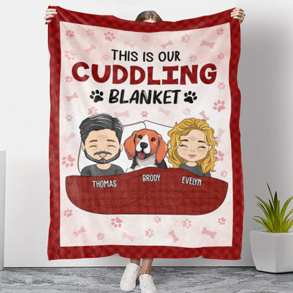 Personalized Couple Cuddling Blanket featuring cartoon couple and pet, "This is our cuddling blanket" on a red fleece blanket