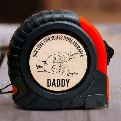 Personalized tape measure for Daddy with 'Our love for you is immeasurable' message, a perfect Father's Day gift.